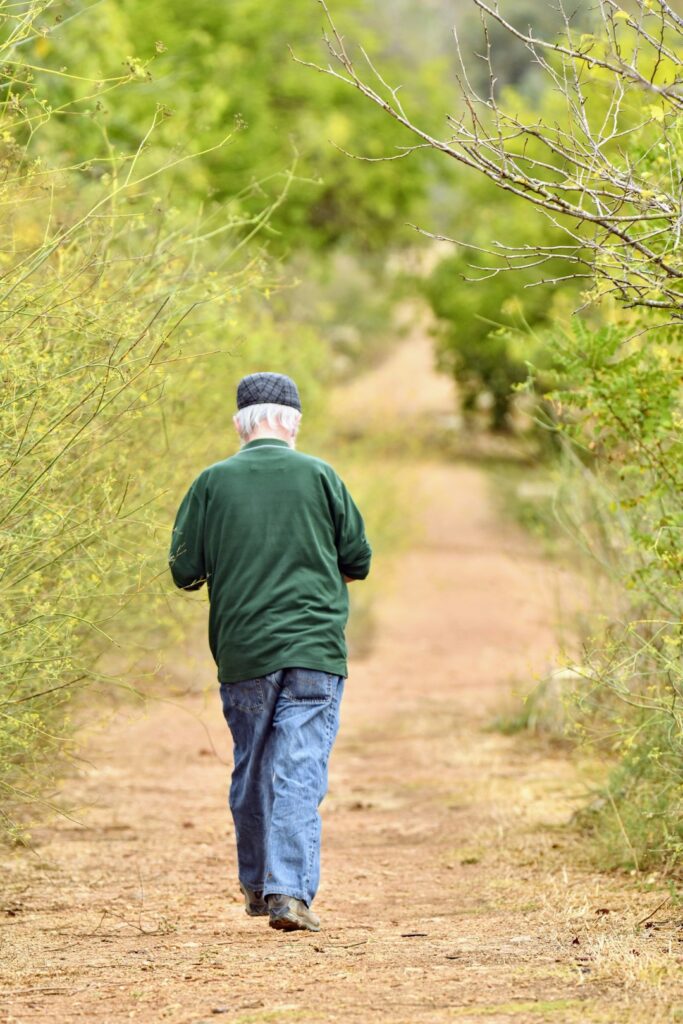 I captured this elderly man out for a walk in the woods by himself.